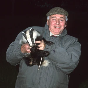 Derek Warren holding a badger
